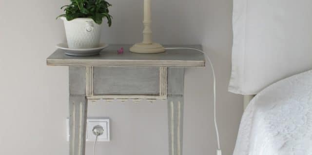 white table lamp on gray end table